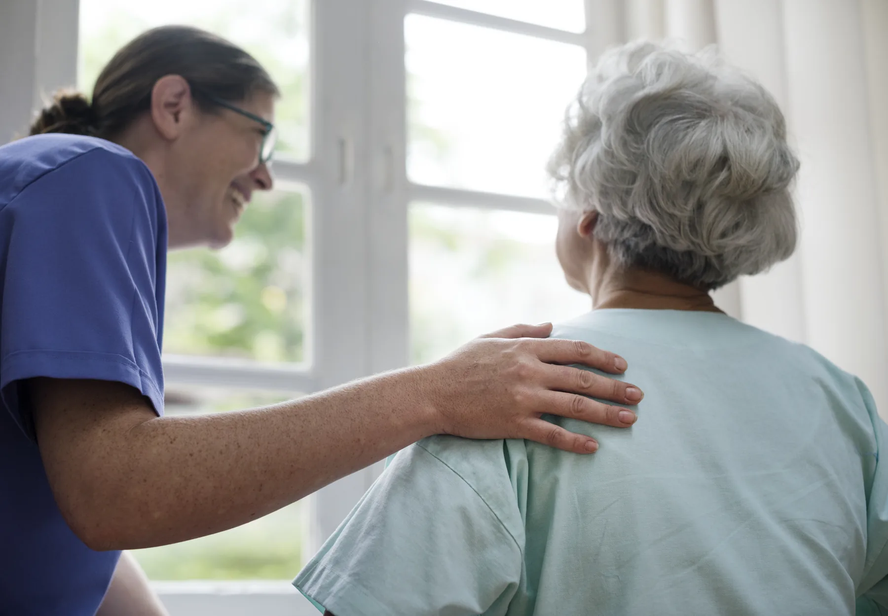 Sweet Grace caregiver supporting a senior at home